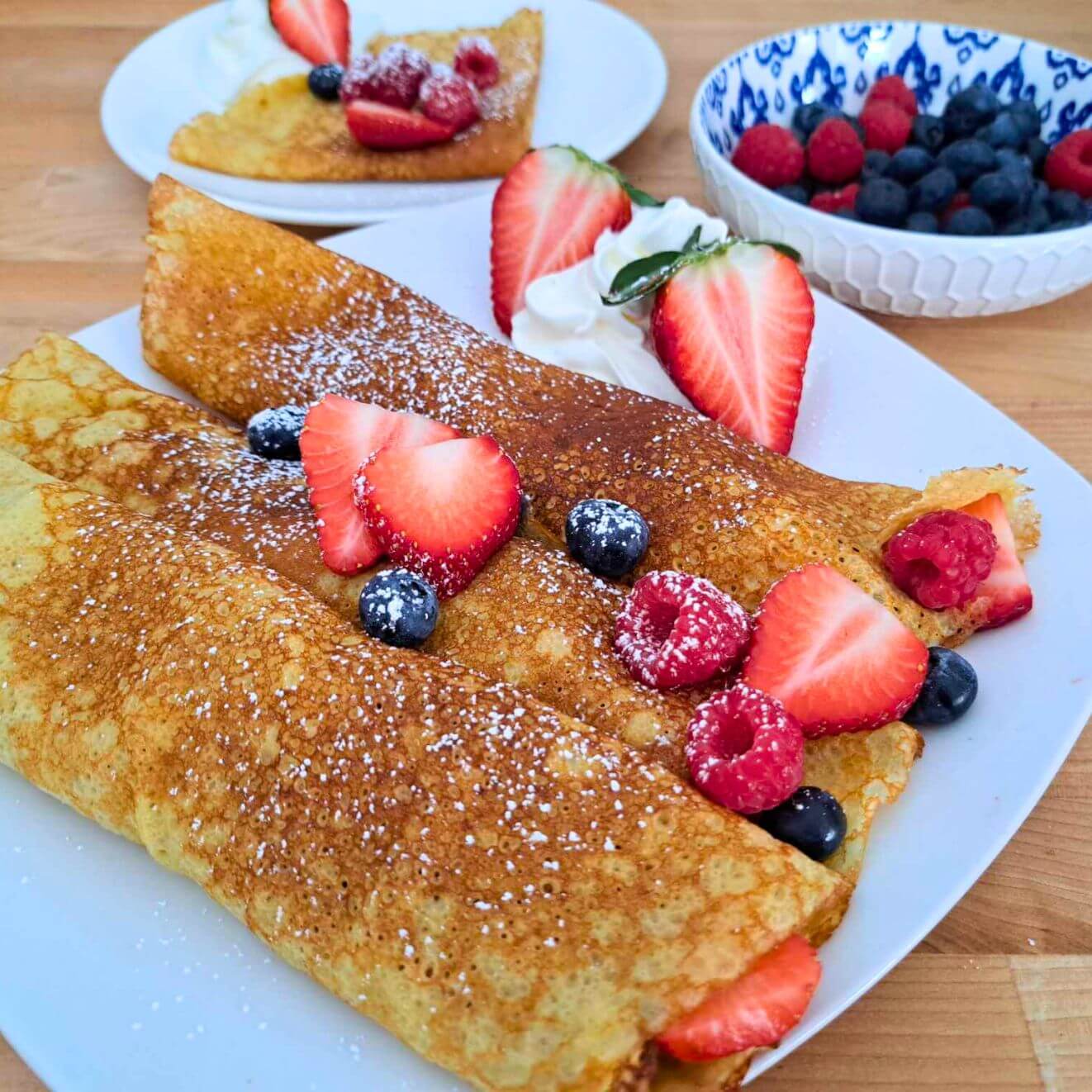 fresh milled flour crepes with berries and whipped cream
