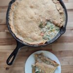 chicken pot pie with homemade fresh milled flour pie crust in a cast iron skillet