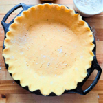 fresh milled flour pie crust in lodge cast iron pie pan