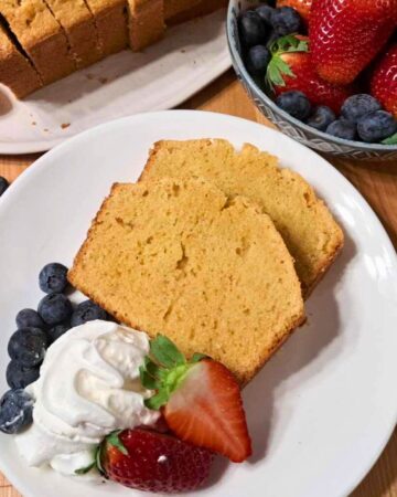 fresh milled flour pound cake with whipped cream and berries