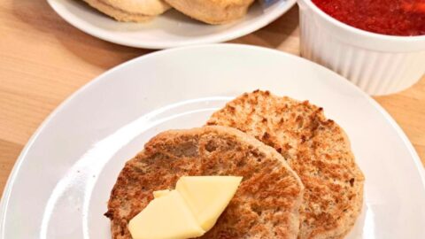 fresh milled flour homemade English muffins on plate with butter and jelly