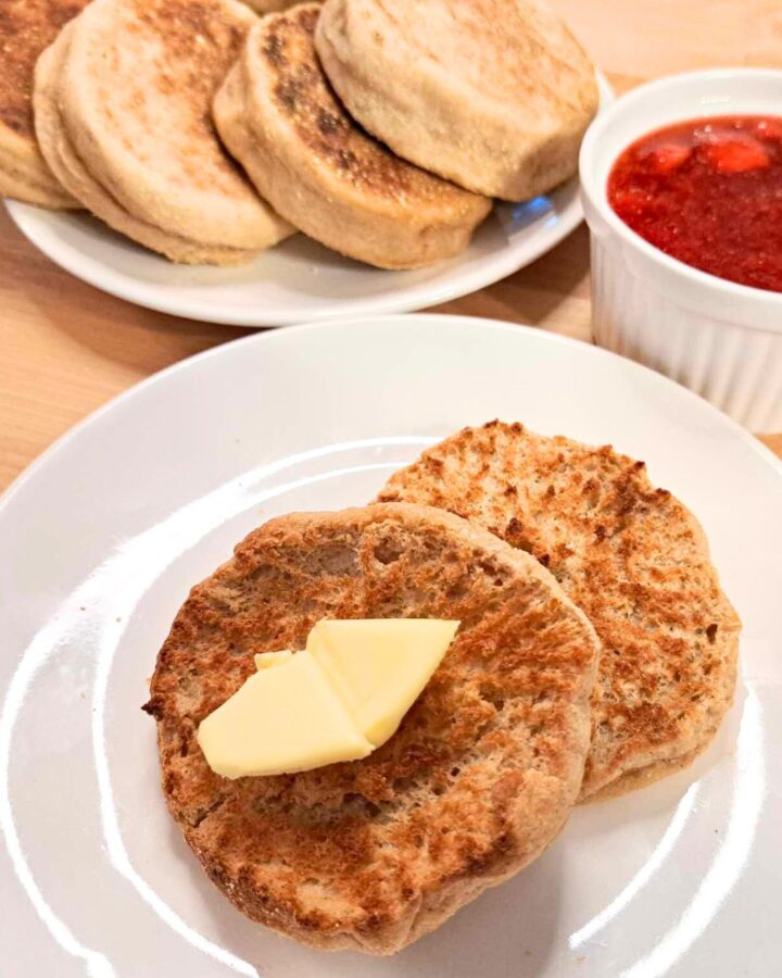 fresh milled flour homemade English muffins on plate with butter and jelly