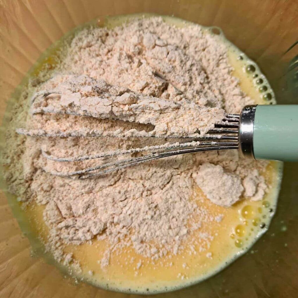 adding flour to wet ingredients