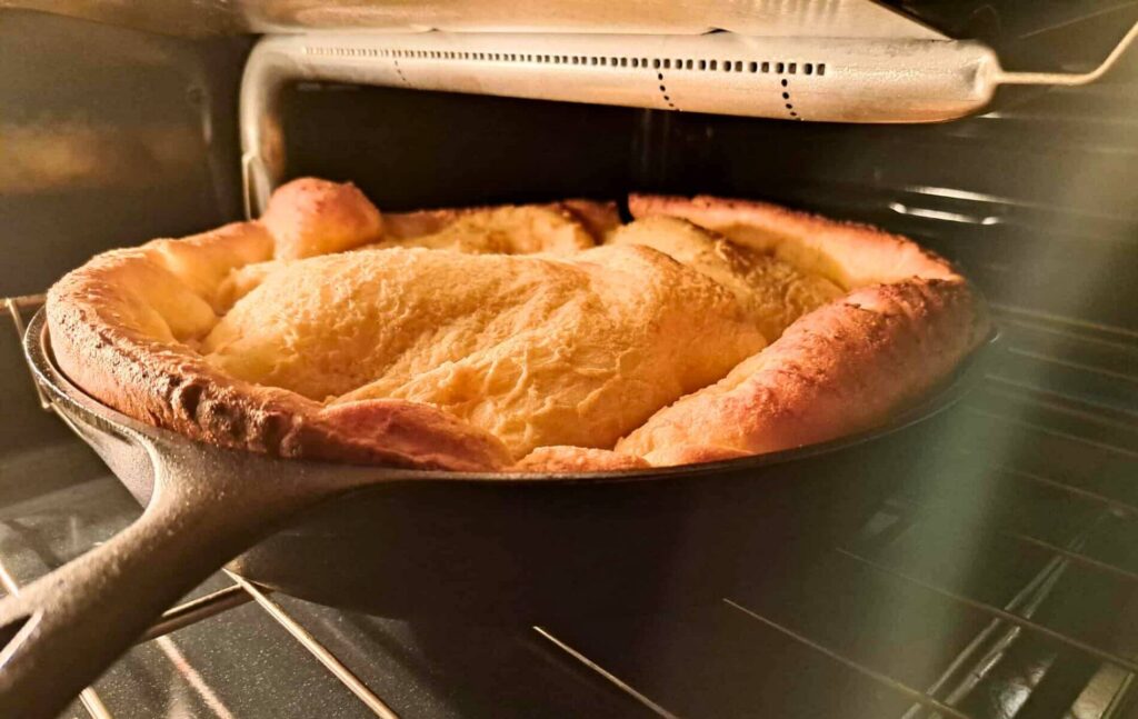 fresh milled flour Dutch baby in 12 inch cast iron skillet in the oven