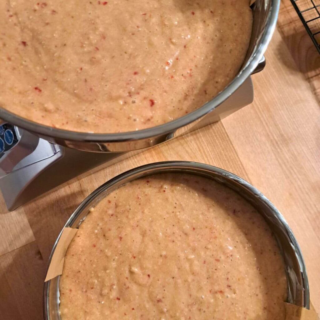 divided cake batter in 9 inch pans
