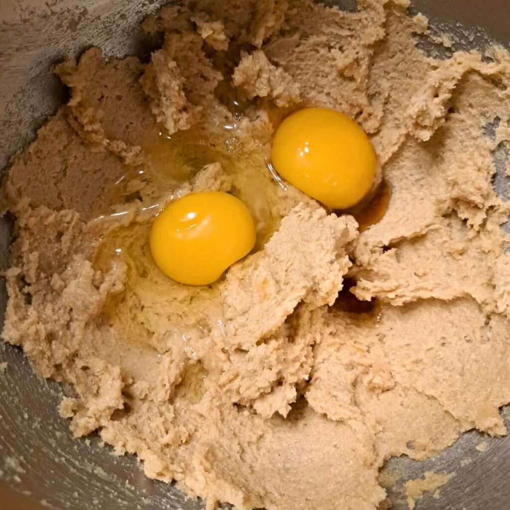 adding egg to creamed butter mixture