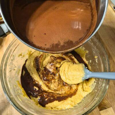 pouring chocolate into batter